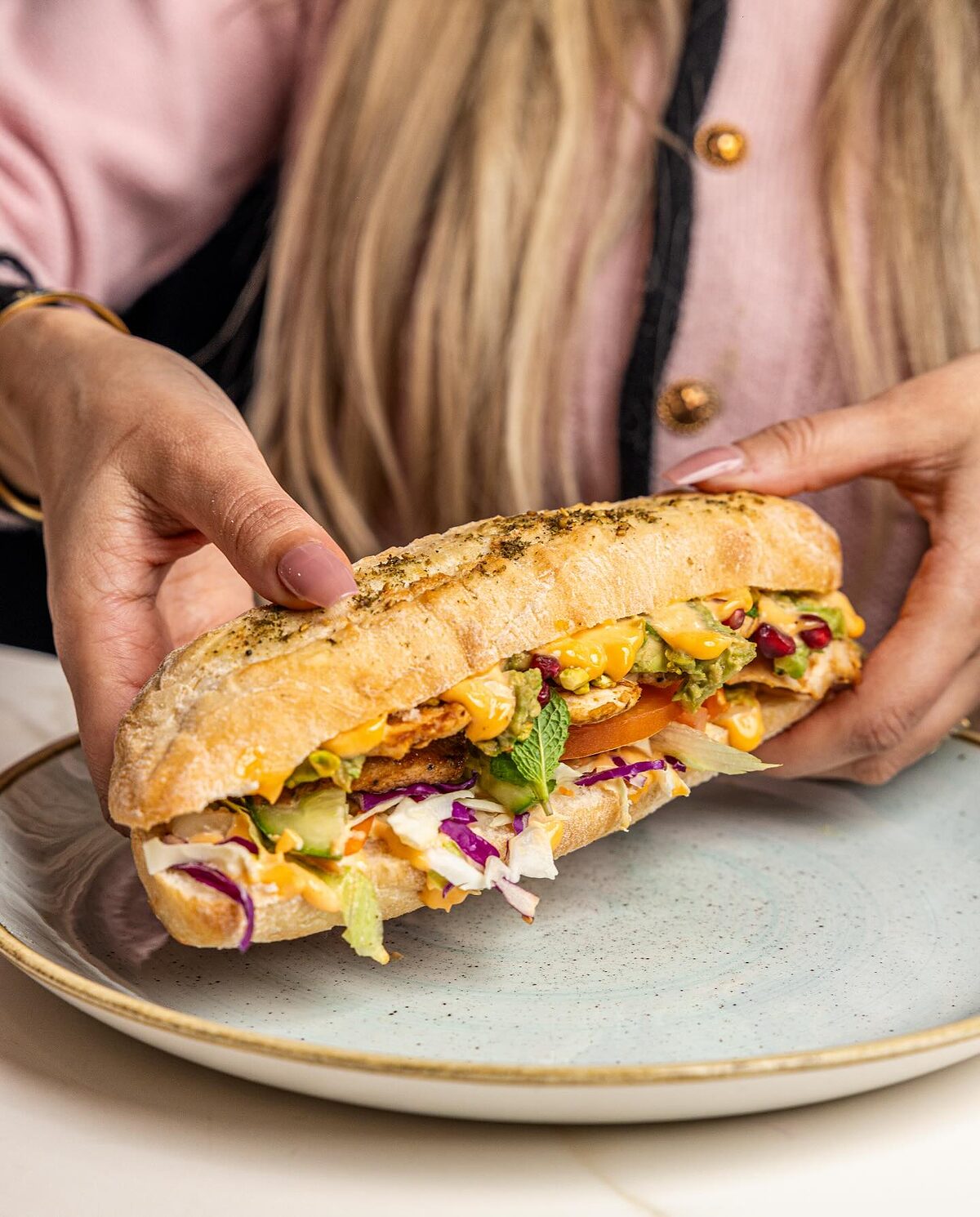 The manager's roll: a toasted herb roll loaded with chicken, cheese, slaw and avocado